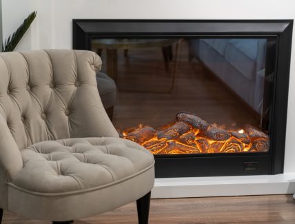 Cozy,Stylish,Armchair,And,Electric,Fireplace,With,Artificial,Sparkling,Flame,