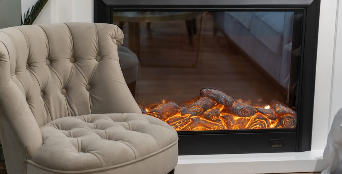 Cozy,Stylish,Armchair,And,Electric,Fireplace,With,Artificial,Sparkling,Flame,